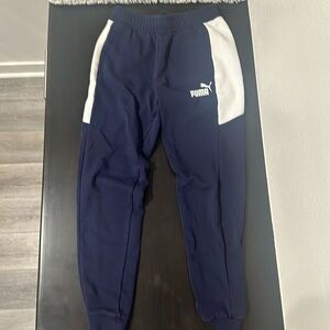 size small men’s color block puma joggers. navy blue and white
